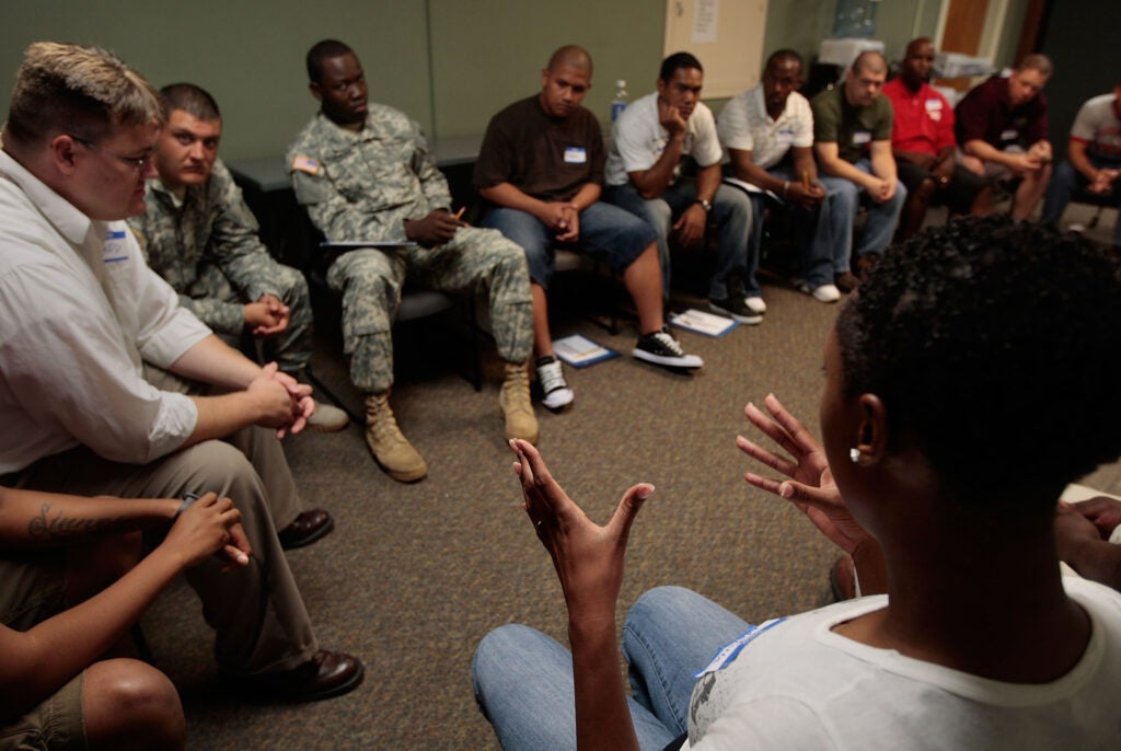 FORT RILEY, KS - AUGUST 13:  Soldiers in the U.S. Army 1st Infantry Division talk during an ASIST seminar (Applied Suicide Intervention Skills Training), a suicide prevention class, August 13, 2009 in Fort Riley, Kansas.  Soldiers are encouraged to come to the ASIST seminar out of uniform, so that officer status and rank do not prevent participants from having  frank and open discussions about the issues around suicide. The Army requires all soldiers take suicide awareness classes as longer and more frequent deployments in Iraq and Afghanistan in recent years have taken a toll, with 96 reported Army suicides so far through July 31 of this year.  Thousands of soldiers have returned from deployments in Iraq and Afghanistan with Post Traumatic Stress Disorder and other mental difficulties.  (Photo by Chris Hondros/Getty Images)