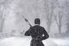 A tomb guard from the 3d U.S. Infantry Regiment (The Old Guard) walks the mat during a snow storm at the Tomb of the Unknown Soldier at Arlington National Cemetery, Arlington, Va., Jan. 3, 2022. (U.S. Army photo by Elizabeth Fraser / Arlington National Cemetery / released)