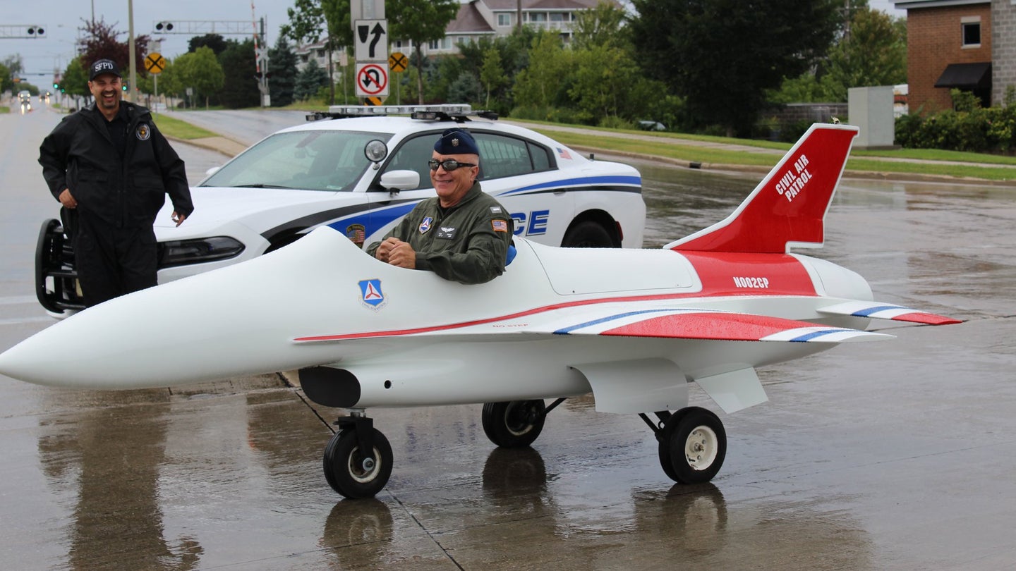 Ron Koplin, the commander of the Civil Air Patrol Timmerman Composite Squadron, drives a mini F-16 in a parade in St. Francis, Wisconsin. (Photo courtesy Ron Koplin / CAP Timmerman)