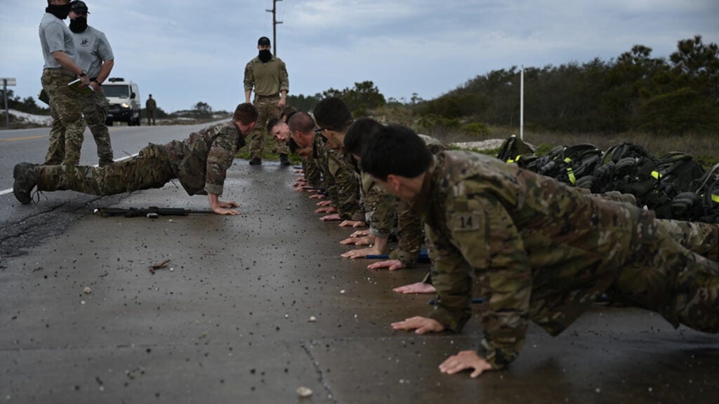 U.S. Air Force Special Tactics Officer and Combat Rescue Officer candidates perform pushups during an assessment and selection March 22, 2021 at Hurlburt Field, Florida. STO/CRO selection is an arduous process, which screens candidates to become leaders in the elite Air Force Special Warfare community, leading global access, precision strike and personnel recovery. (U.S. Air Force photo by Staff Sgt. Ridge Shan)