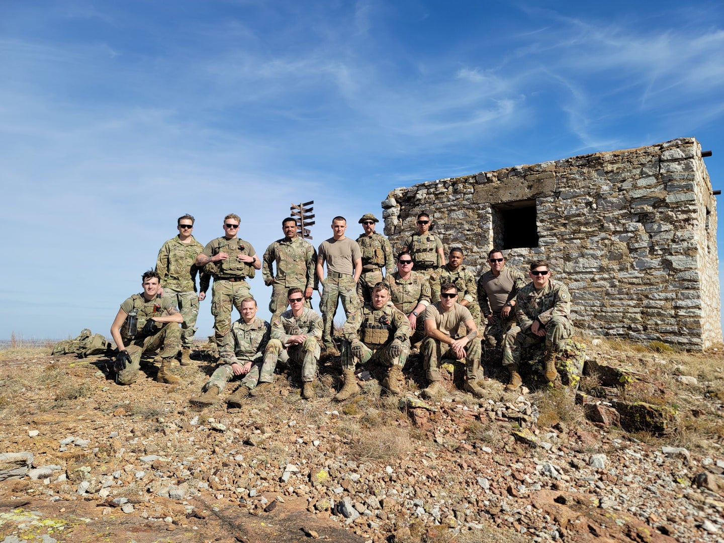 U.S. Army Explosive Ordnance Disposal technicians from the 761st Ordnance Company (EOD) pose in front the Block House on Fort Sill, Oklahoma. During a two-day mission, the company cleared a path through 145 unexploded rounds on an artillery range to historic building to enable a visit by 40 senior leaders from the Fires Center of Excellence. Courtesy photo.