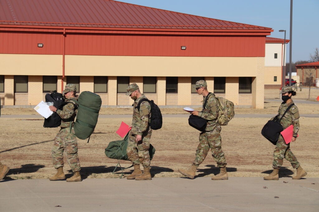 More than 2,000 trainees with 434th Field Artillery Brigade, Basic Combat Training, packed, lined up and prepared to board a bus or get into a car to go home for the holidays Dec. 16, 2021 at Fort Sill.