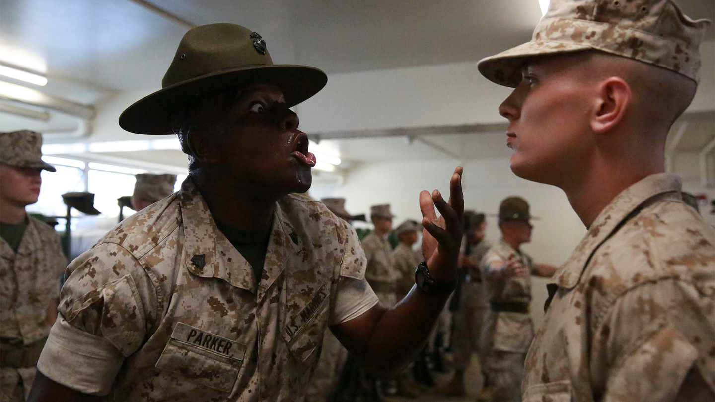 A drill instructor from Alpha Company, 1st Recruit Training Battalion, tests a recruit’s knowledge during the senior drill instructor inspection at Marine Corps Recruit Depot San Diego, Sept. 26, 2016.