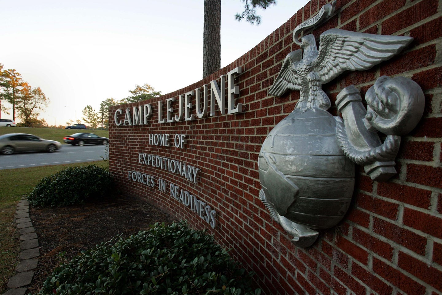 Cars enter the main gate at Camp Lejeune in Jacksonville, N.C. Friday, Dec. 2, 2005. (AP Photo/Gerry Broome)