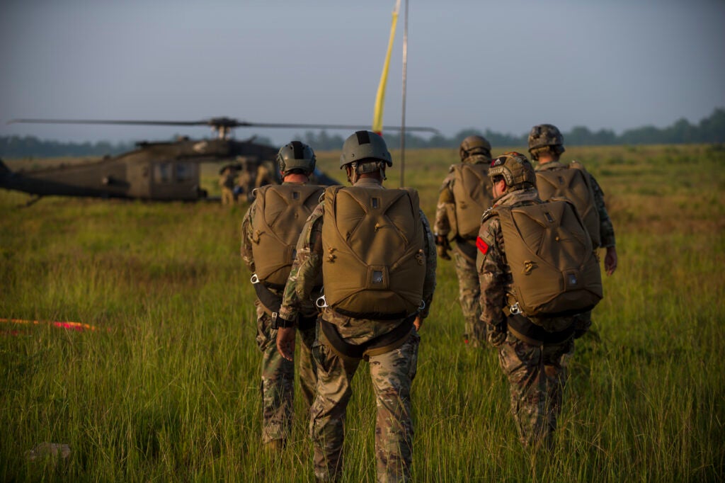 U.S. Army Reserve and active duty Soldiers perform an airborne operations jump from UH-60 Black Hawk helicopters at Fort Bragg, North Carolina, July 17, 2020. Soldiers who are assigned to airborne units must complete a parachute jump every three months to retain jump certification. Soldiers who jumped on this day included members from the U.S. Army Civil Affairs &amp; Psychological Operations Command (Airborne) headquarters, 824th Quartermaster Company, the 478th Civil Affairs Battalion, and 647th Quartermaster Company among other local units at Fort Bragg. (U.S. Army Reserve photo by Master Sgt. Michel Sauret)