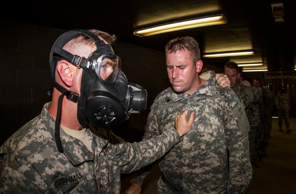 Officers in the Chaplain's Basic Officer Leaders Course prepare to exit the CBRN chamber, but only after receiving a brief introduction to a small dose of CS gas. The 104th Training Division (LT) facilitated the training at the facility. (U.S. Army photo by Sgt. 1st Class Brian Hamilton)