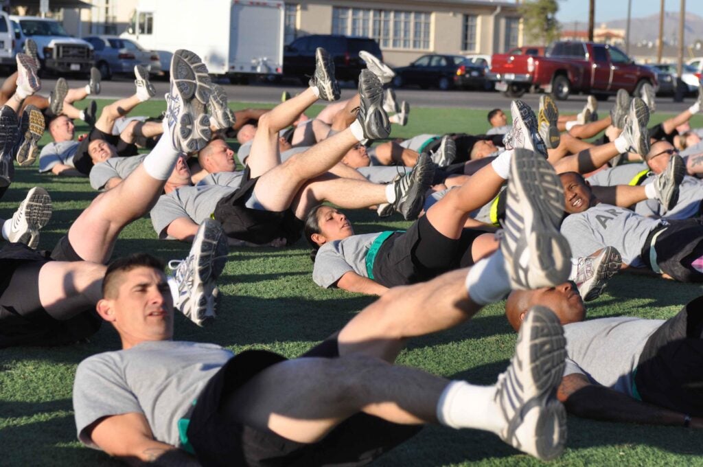 Soldiers from 5th Armored and 402nd Field Artillery Brigades, do 150 four-count flutter kicks led by Commanding General Lt. Gen. Mick Bednarek, First Army, at Fort Bliss, Texas, April 28.  Bednarek led the motivational physical training session as part of team-building between the two brigades.