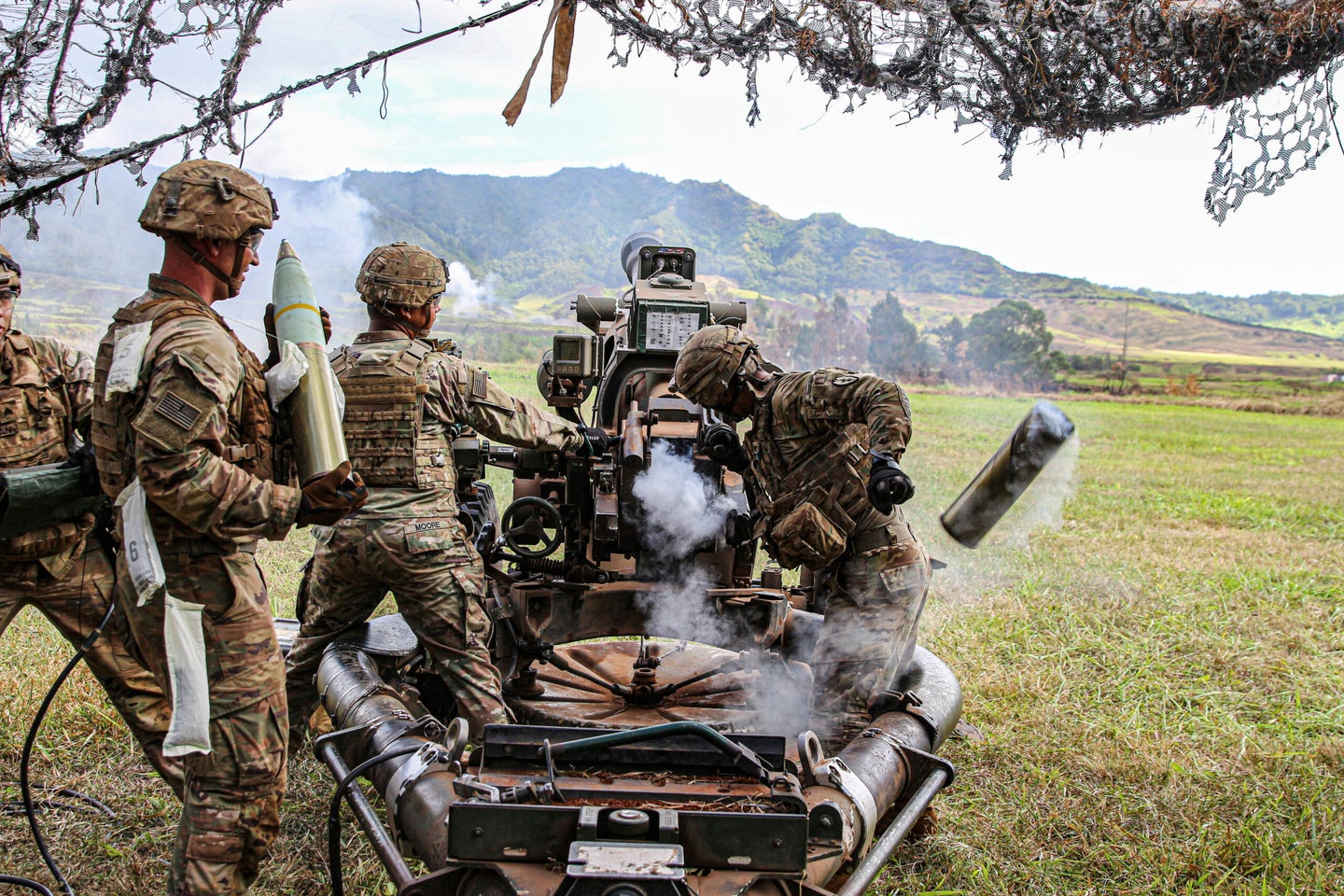 Soldiers with 2nd Battalion, 11th Field Artillery, 25th Infantry Division work with M119 Howitzers to enhance their basic artillery skills on Schofield Barracks, Hawaii, June 14, 2020. Cannon Crewmembers from the "On Time" Battalion play a vital role during missions by supporting ground forces, handling ammunition, operating weapon systems, and calculating targets. (U.S. Army photo by 1st Lt. Stephanie Snyder)