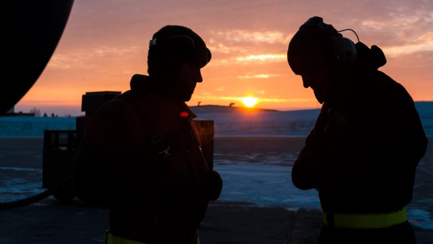 5th Aircraft Maintenance Squadron crew chiefs try to stay warm before launching an aircraft at Minot Air Force Base, N.D., Jan 26, 2017. Crew chiefs arrive at the aircraft before the aircrew to perform pre-flight inspections to ensure a safe launch. (U.S. Air Force photo by Senior Airman J.T. Armstrong)
