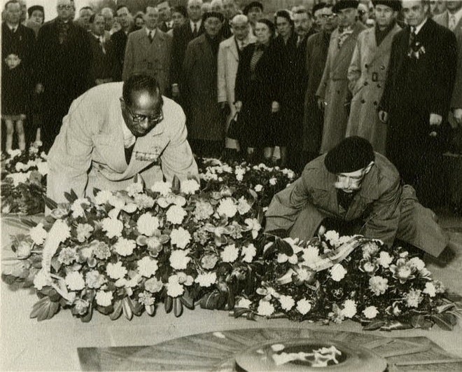 Eugene Bullard, the first African-American military pilot, at the Tomb of the Unknown Soldier in Paris (1954). He was invited by the Committee of the Flame to rekindle the fire in 1954. (Air Force photo)