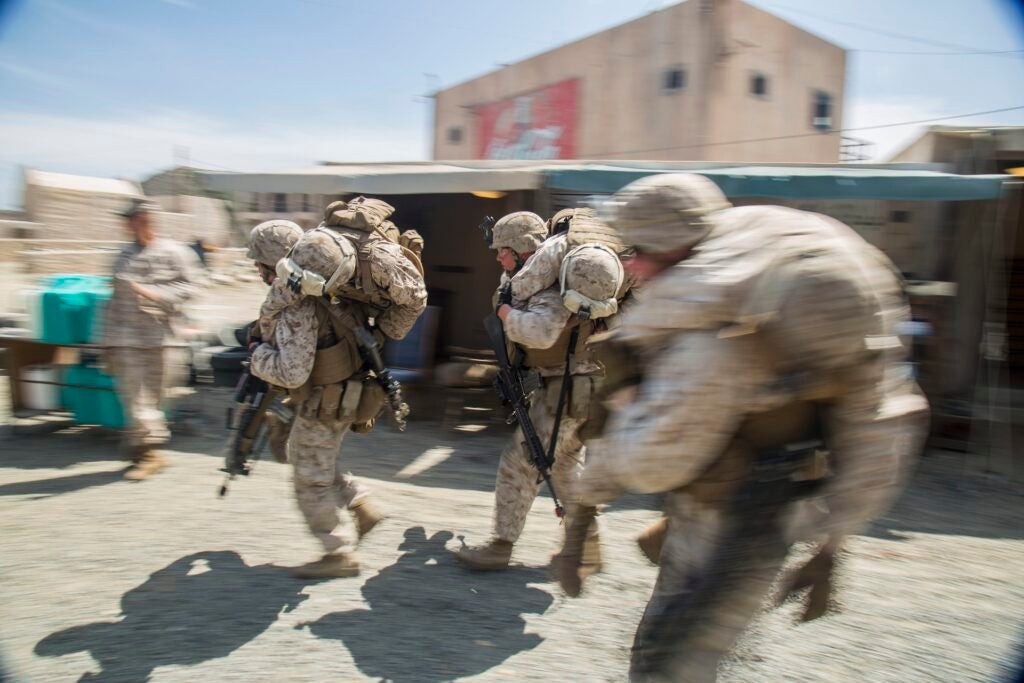 Marines with Company "G", 2nd Battalion, 1st Marine Regiment, fireman carry injured Marines to safety during a training exercise at the Infantry Immersion Trainer (IIT) aboard Camp Pendleton, Calif., July 31, 2015. The IIT provides a training facility for “hands on” practical application of tactical skills and decision-making in an immersive, scenario-based training environment.  (U.S. Marine Corps photo by Sgt Hector de Jesus/Released)
