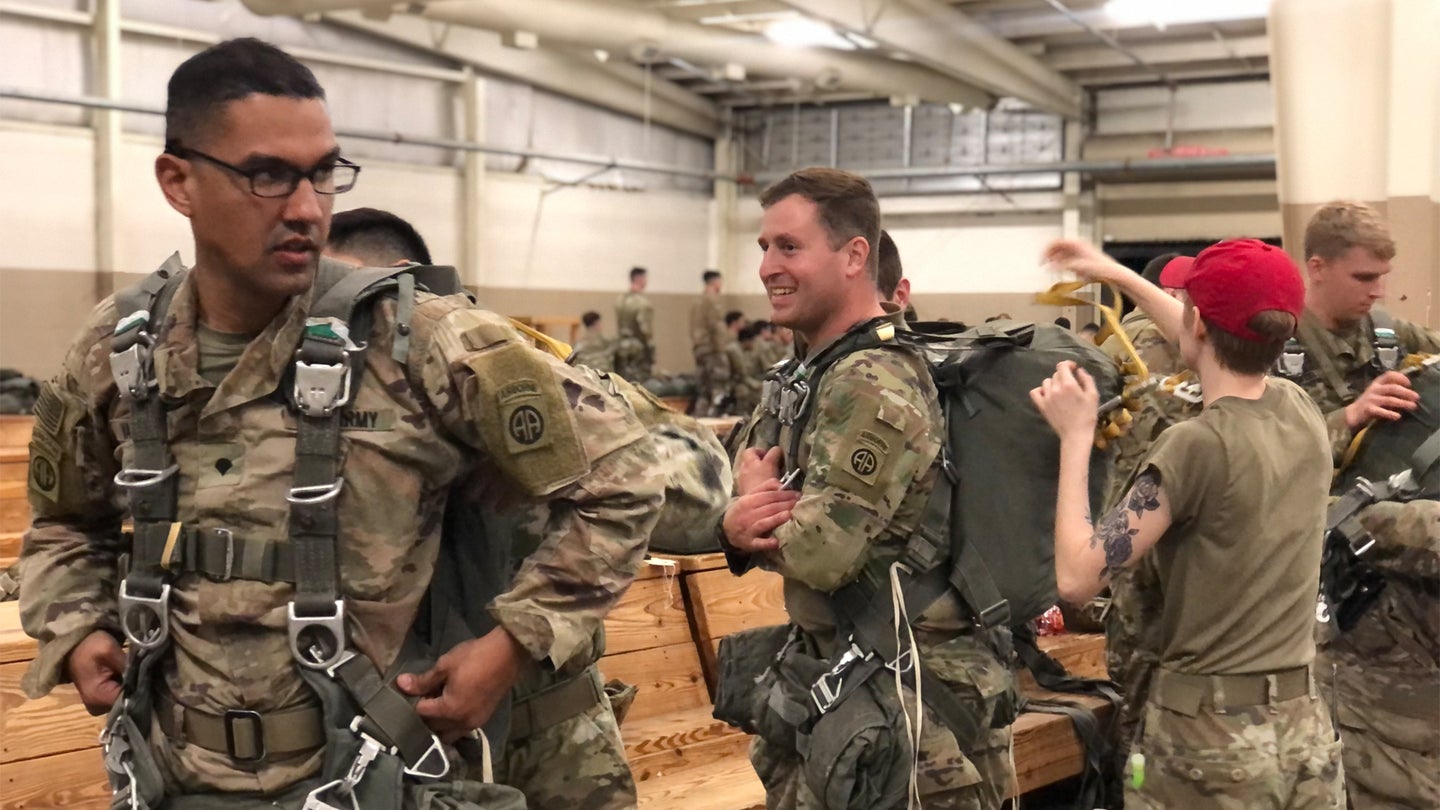 Army Paratroopers prepare their gear ahead of a night jump at Fort Bragg, North Carolina. (Task & Purpose/Haley Britzky)