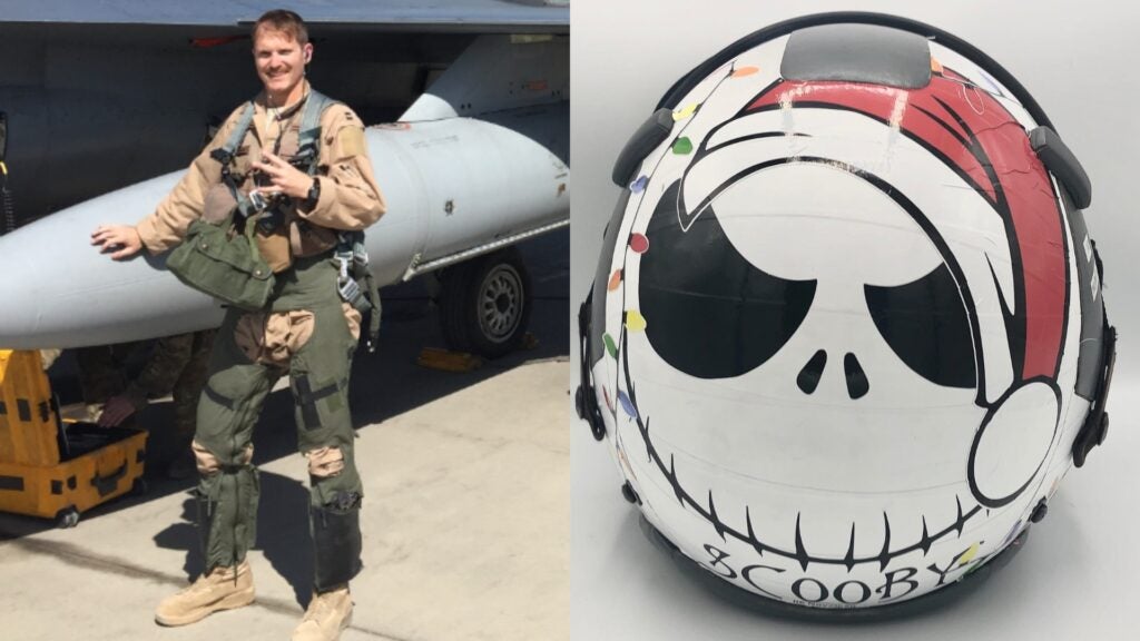 Maj. Brad "Scooby" Hunt with an F-16 after a sortie in Afghanistan (left) and one of his custom helmet wraps. "Scooby" stands for SAM [surface to air missile]Closing On Own Ship Bail Out You, which Hunt earned after pulling the ejection handle during a simulation and accidentally shutting down the simulator for his other pilots. (Photos Courtesy Brad Hunt)