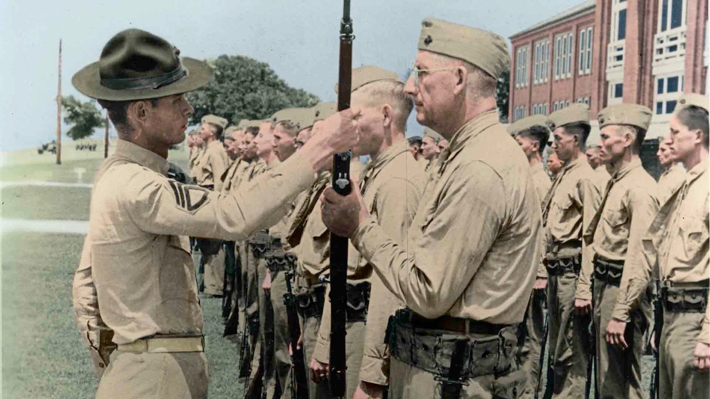 Pvt. Paul Douglas, age 50, preforms a rifle inspection with his drill instructor aboard Marine Corps Recruit Depot S.C., 1942. Douglas, at age 50 was the oldest recruit in the history of Parris Island, and went on to become a purple heart recipient and Chicago senator.(Marine Corps photo.)