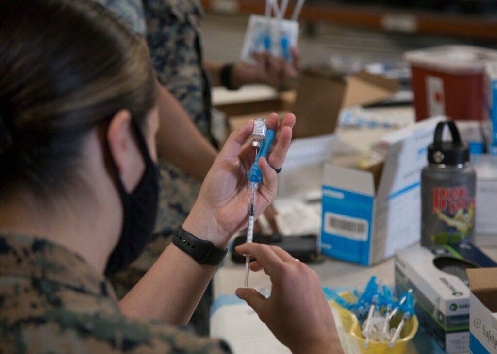 Marines and Sailors continue to receive the COVID-19 vaccine on Marine Corps Air Station Miramar, March 25, 2021. Vaccines are being administered in a phased approach, prioritizing health care workers and first responders, as well a mission critical and deploying personnel. (U.S. Marine Corps photo by Lance Cpl. Alondra Ortiz-Montejano)