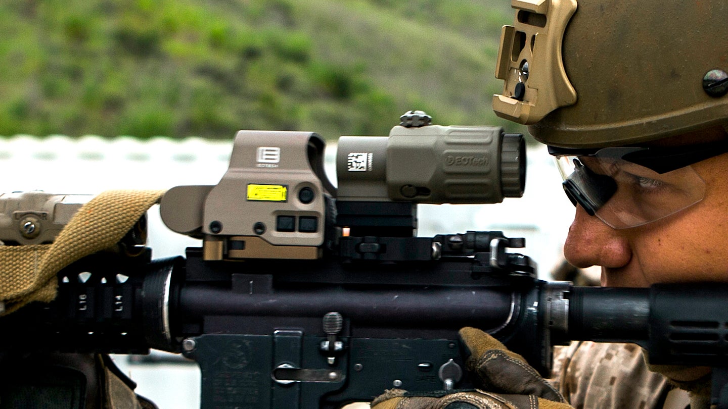 U.S. Marine Corps Pfc. Kristefor Nikolic, a fire support marine assigned to 1st Air Naval Gunfire Liaison Company (ANGLICO), I Marine Expeditionary Force Information Group, sights in using the EOTech Holographic Hybrid Sight III during a live fire range on Marine Corps Base Camp Pendleton, California, May 28, 2020.