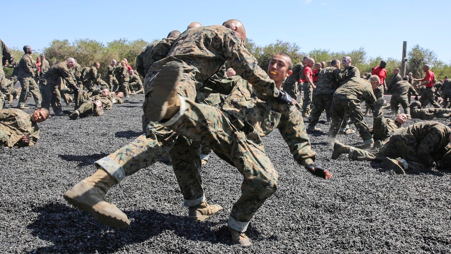 Recruits of Alpha Company, 1st Recruit Training Battalion, execute a leg-sweep takedown during a Marine Corps Martial Arts Program session at Marine Corps Recruit Depot San Diego, June 13, 2016. (U.S. Marine Corps photo by Cpl. Jericho Crutcher)