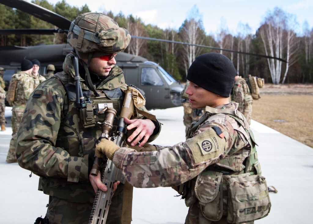 A Paratrooper assigned to the Troop B, 5-73 Cavalry 82nd Airborne Division trains a Polish soldier assigned to the 21st Rifle Brigade on his squad designated marksman rifle during a combined training event at Feb 22 at Nowa Deba, Poland. The training event allowed the Allies to get to know each other’s equipment, capabilities and tactics to enhance our readiness and strengthen our NATO Alliance.The 82nd Airborne Division is currently deployed to Poland to train with and operate alongside our Polish Allies, and it serves as a great opportunity to improve tactical training and increase our interoperability across all domains. The 82nd Airborne Division's mission is to assure our Allies as they have a host of unique capabilities and conduct a wide range of missions that are scalable and tailorable to mission requirements. (U.S. Army Photo by Master Sgt. Alexander Burnett)