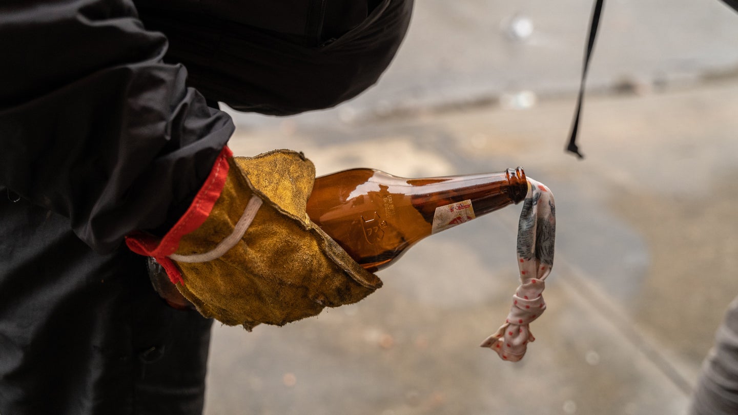 A protester holds a molotov cocktail during a protest in Popayan, Colombia. (Photo by David Lombeida/SOPA Images/LightRocket via Getty Images)