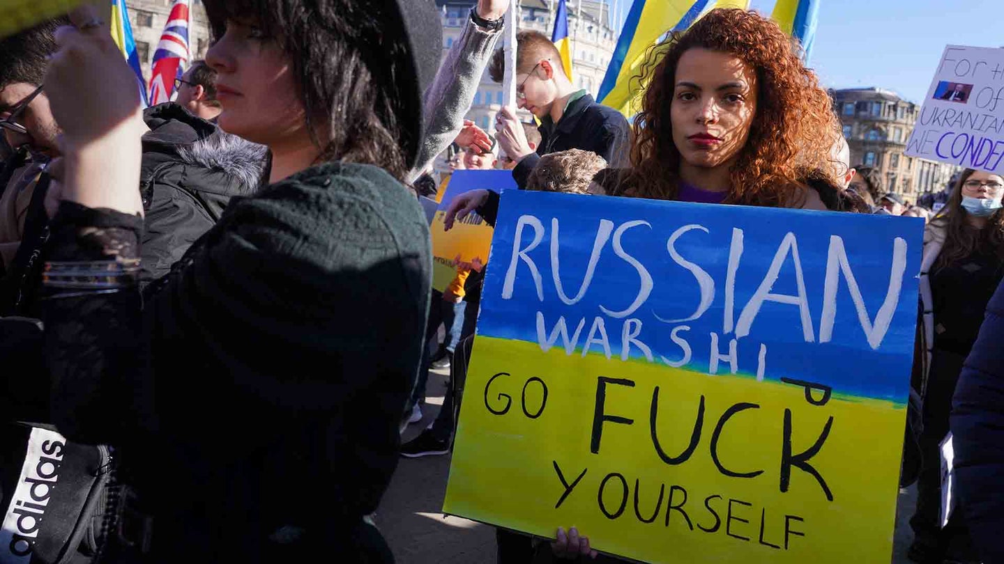Placard with the same message Ukrainian soldiers on Snake Island sent to the Russians when asked to give themselves up as thousands of people turn out at Trafalgar Square for a pro-Ukrainian peace protest calling for an end to Russia's war in Ukraine on Feb. 27 in London, United Kingdom.(Kristian Buus/In Pictures via Getty Images)