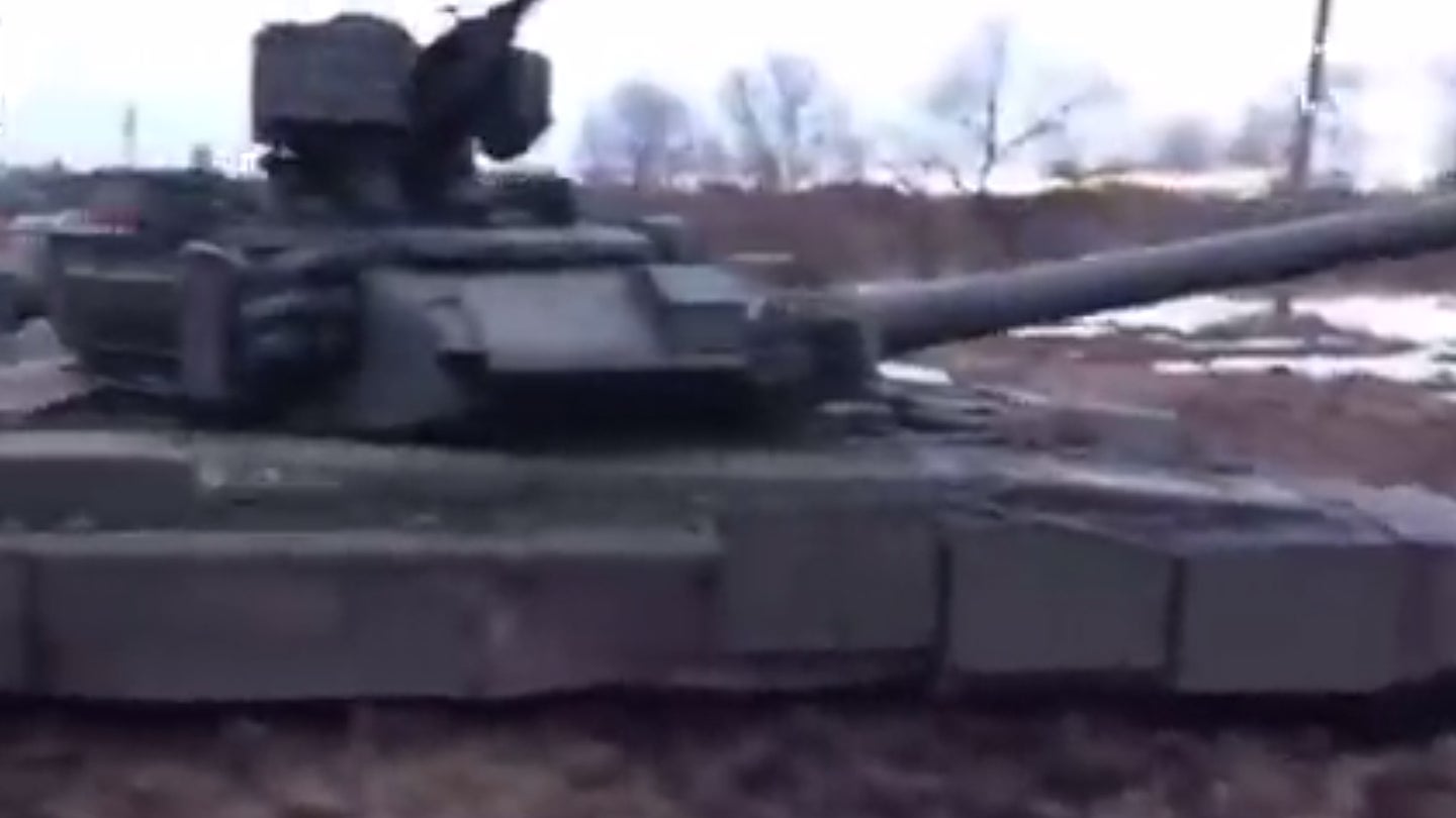 A screengrab from a video posted to Twitter appearing to show Russian military vehicles mired in the mud in Ukraine.