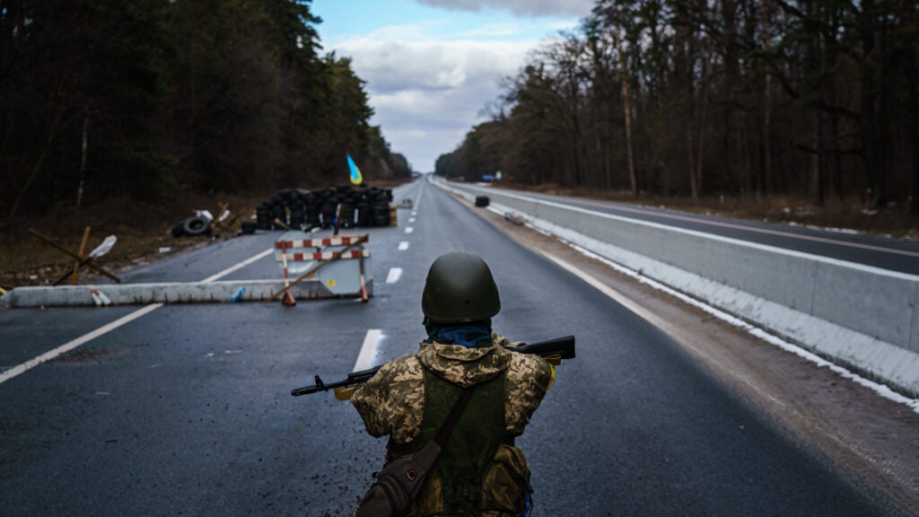 Soldiers arrive to reinforce one of the final checkpoints before the frontlines where Ukrainian forces are battling invading Russian forces near Brovary, Ukraine, Tuesday, March 8, 2022. (MARCUS YAM / LOS ANGELES TIMES via Getty Images)