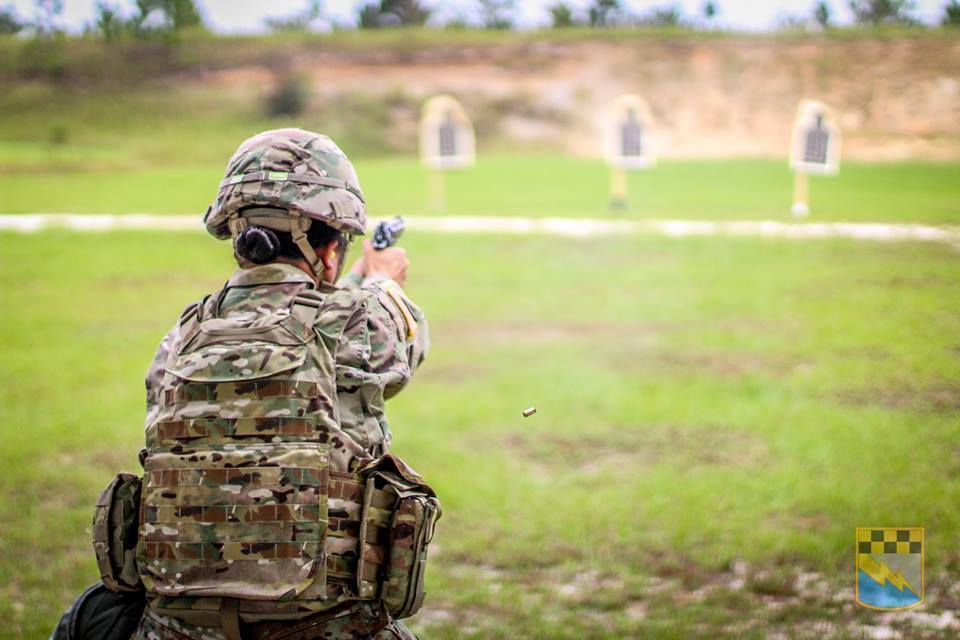 FORT BRAGG, N.C. - Sgt. Cynthia Hedrick of Alpha Company, 519th Military Intelligence Battalion, 525th Military Intelligence Brigade, engages targets from the crouching position during readiness and weapon qualification training on September 25, 2018. (U.S. Army photo by Sgt. Jeremiah Meaney, 525th MI BDE PAO/Released)