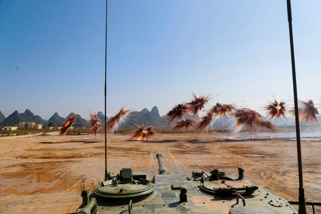 GUILIN, CHINA - NOVEMBER 30: Armored assault vehicles of the People's Liberation Army fire smoke bombs to test new weaponry on November 30, 2021 in Guilin, Guangxi Zhuang Autonomous Region of China. (Photo by Huang Yuanli/VCG via Getty Images)