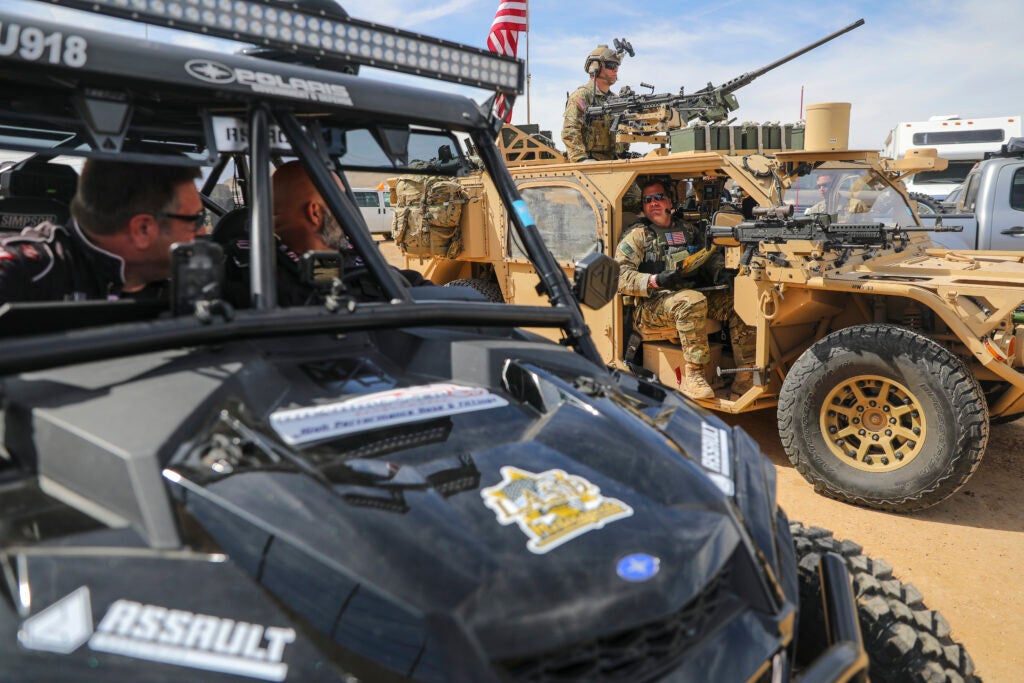 Green Berets with the 5th Special Forces Group (Airborne), converse with other racers prior to racing in the Mint 400, March 06, 2020, in Primm, Nevada. (U.S. Army photo by Staff Sgt. Justin Moeller, 5th SFG(A) Public Affairs)