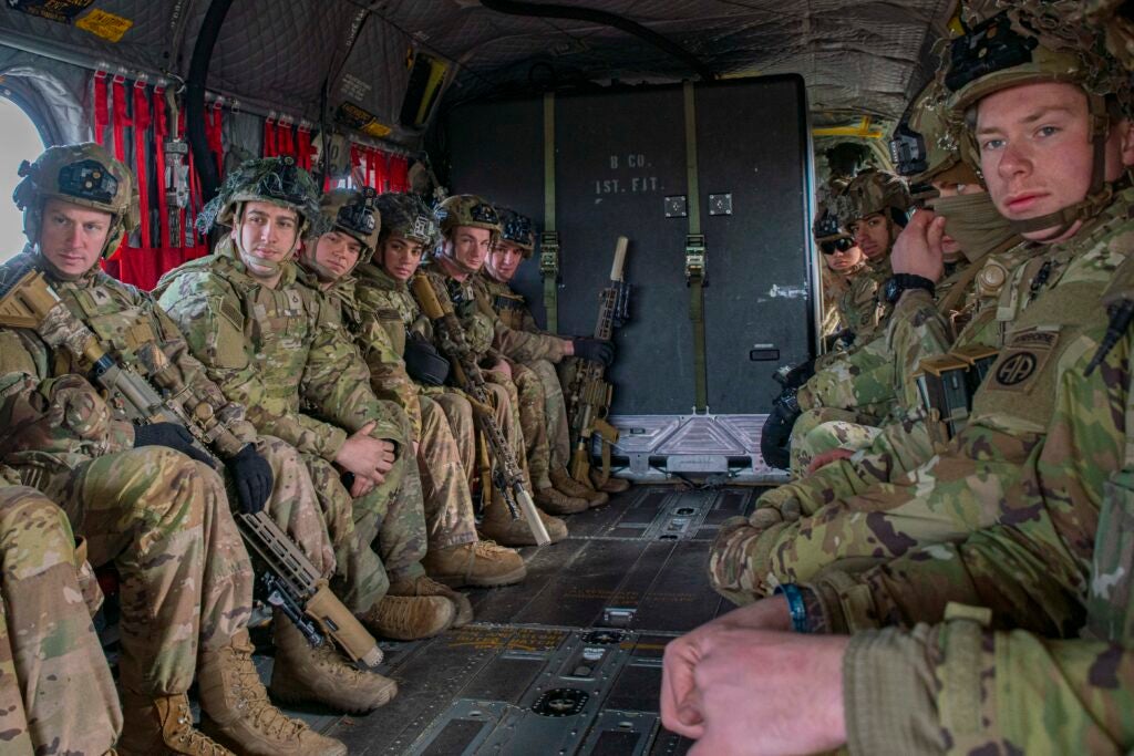 U.S. Paratroopers assigned to 3rd Brigade Combat Team, 82nd Airborne Division ride in a CH-47 Chinook during an air assault training event in Nowa Deba, Poland, March 3, 2022. The focus of the 82nd Airborne Division's mission is to assure our Allies by providing a host of unique capabilities and conducting a wide range of missions that are scalable and tailorable to mission requirements. (U.S. Marine Corps photo by Sgt. Claudia Nix)