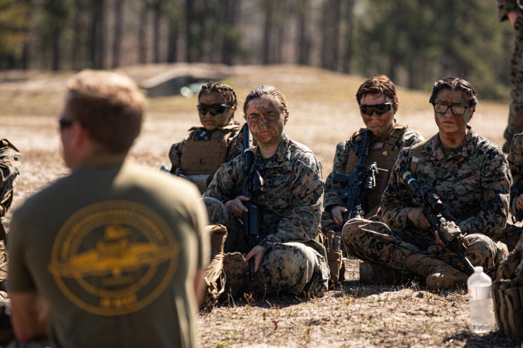 U.S. Marines with the Female Engagement Team attached to the 22nd Marine Expeditionary Unit (MEU) participate in a brief during a live-fire training event on Marine Corps Base Camp Lejeune, March 2, 2022. Members of the Female Engagement Team attached to the MEU participated in live-fire training to build and sharpen their skills in combat marksmanship held by Golf Company, 2nd Battalion, 6th Marine Regiment. (U.S. Marine Corps Photo by Sgt. Armando Elizalde)