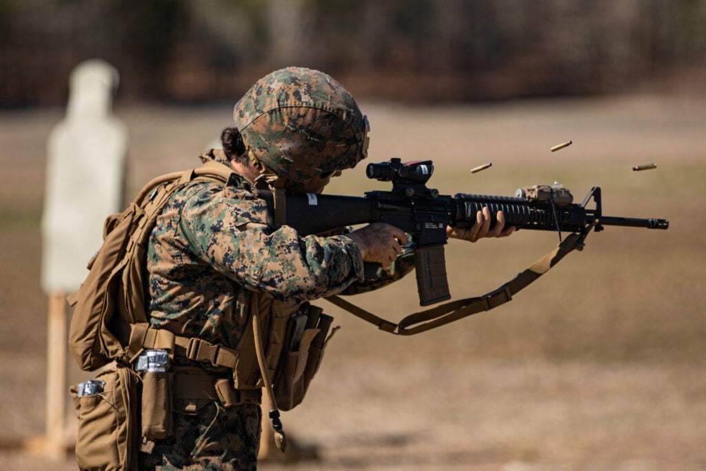 U.S. Marine Corps Cpl. Autumn M. Duckworth, a communications navigations counter systems technician with the 22nd Marine Expeditionary Unit (MEU), fires at targets during a live-fire training event on Marine Corps Base Camp Lejeune, March 2, 2022. Members of the Female Engagement Team attached to the MEU participated in live-fire training to build and sharpen their skills in combat marksmanship held by Golf Company, 2nd Battalion, 6th Marine Regiment. (U.S. Marine Corps Photo by Sgt. Armando Elizalde)
