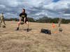 U.S. Army Reserve Spc. Noraelia Cruz, 273rd ICW, practices the standing power throw at Camp Bullis, Texas, March 4, 2022. The standing power throw is one event in the Army Combat Fitness Test. (U.S. Army photo by 1st Lt. Mary Kate Outenreath)