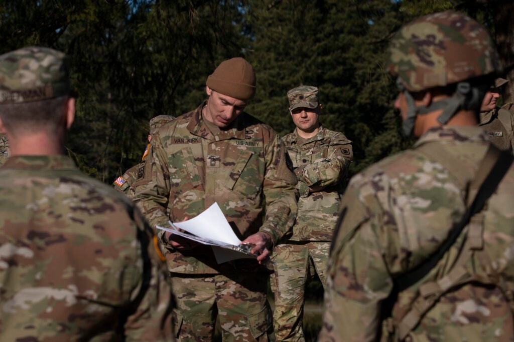 U.S. Army Sgt. 1st Class Nicholas Vankirk with the 96th Troop Command, Washington National Guard, briefs a land navigation course during the state Best Warrior Competition at Joint Base Lewis-McChord, Wash, March 5, 2022.  In addition to land navigation, the competition consisted of an Army Combat Fitness Test, board panel, written essay, qualification range, stress shoot, and tactical ruck march. The winning Soldier and NCO—Spc. Eric Smith with 2nd Battalion, 146th Field Artillery, and Staff Sgt. Stormy White with Recruiting and Retention Battalion—will go on to represent Washington in the Region VI Army National Guard Best Warrior Competition this Spring. (U.S. Army National Guard photo by Sgt. Adeline Witherspoon)
