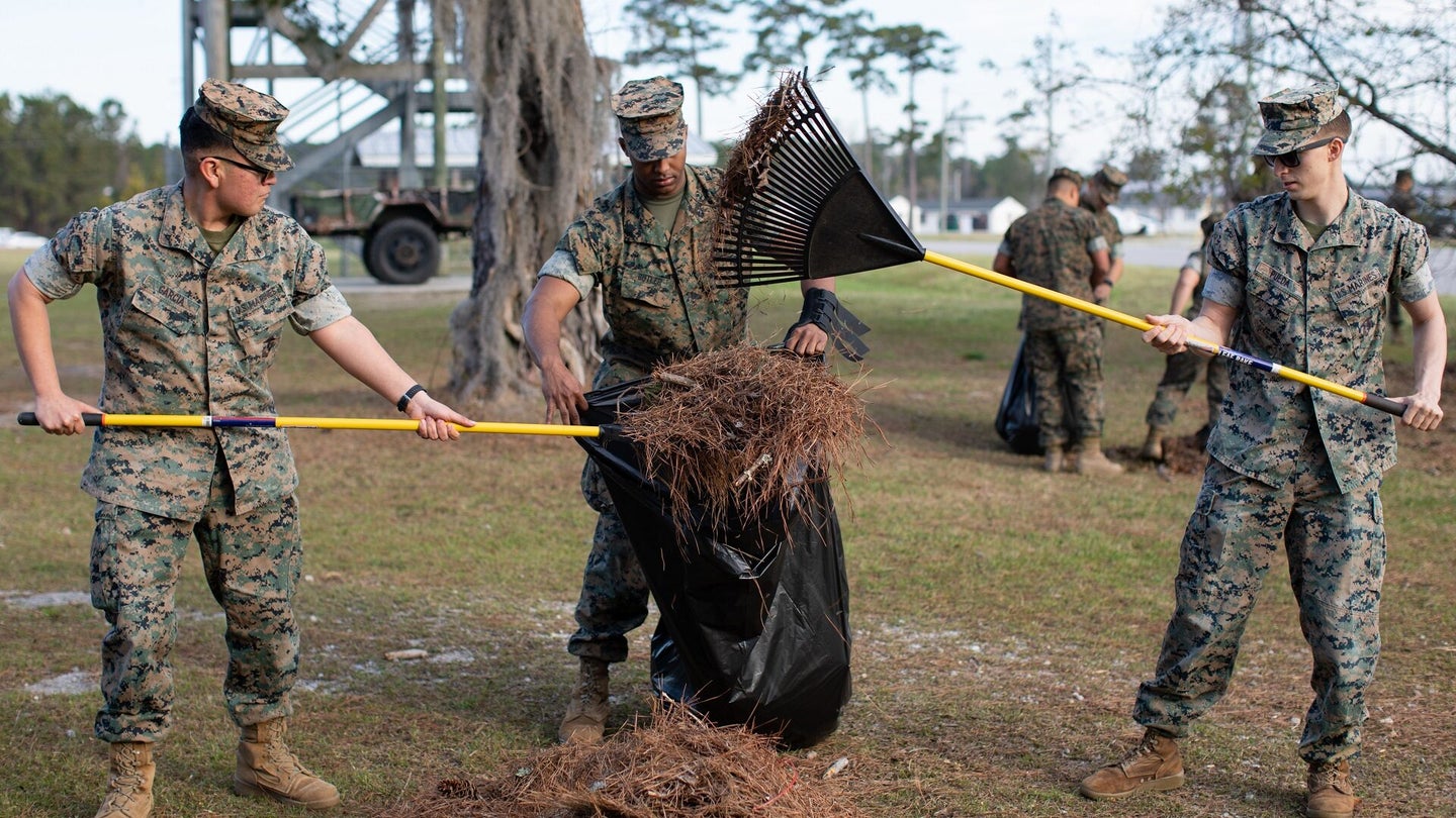U.S. Marines with Marine Corps Combat Service Support Schools (MCCSSS) pick up leaves and litter during a base-wide clean-up on Camp Johnson, N.C. March 22, 2022. To commemorate Earth Day 2022, MCCSSS organized a physical, tangible and immediate benefit to remove safety hazards, improve the environment, and return Camp Johnson to its natural state for all personnel who train, work and live aboard the camp. (U.S. Marine Corps photo by Lance Cpl. Jaiden O. Sangster)