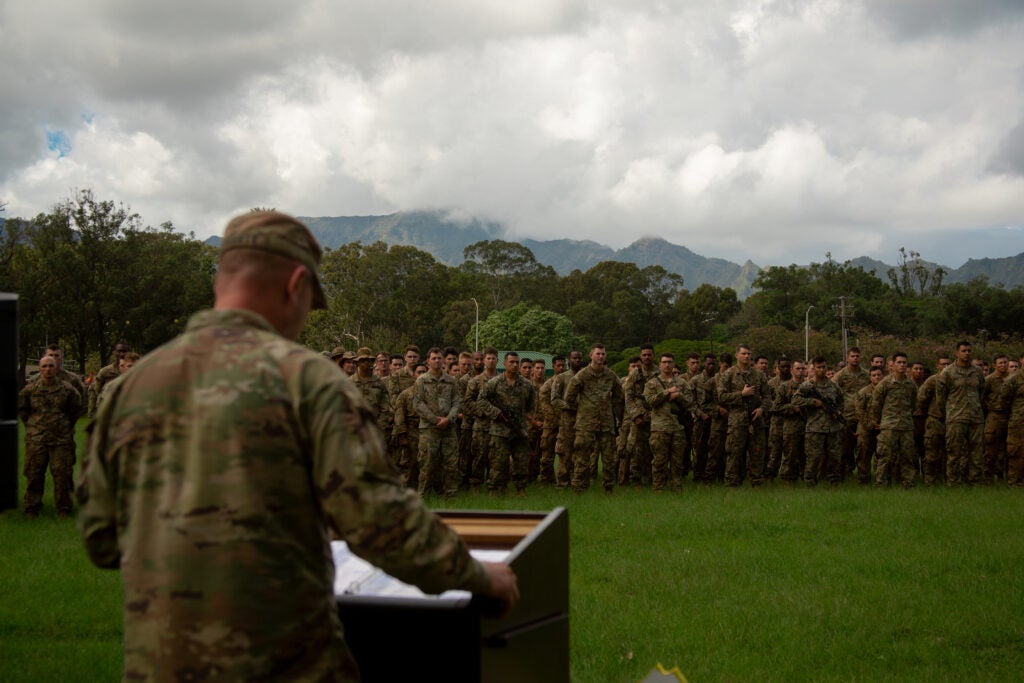 U.S. Marines with 1st Battalion, 12th Marines, 3d Marine Division and Soldiers with 25th Infantry Division stand in formation during an award ceremony on Schofield Barracks, Hawaii, Feb. 4, 2022. Artillery teams with 3d Marine Division and 25th ID competed against one another in a Best by Test competition hosted by 25th Division Artillery to determine the best section in the Pacific. The teams competed in live-fire operations, physical fitness tests, helicopter operations, swim trials and other combat related events. (U.S. Marine Corps photo by Sgt. Melanye Martinez)