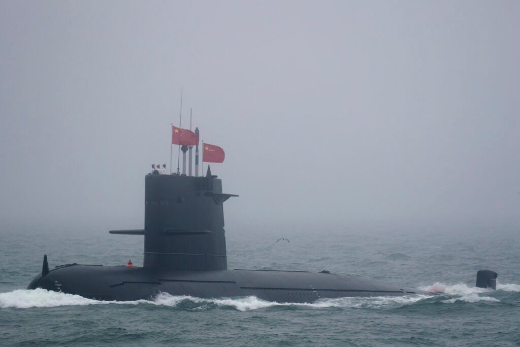 A Great Wall 236 submarine of the Chinese People's Liberation Army (PLA) Navy, billed by Chinese state media as a new type of conventional submarine, participates in a naval parade to commemorate the 70th anniversary of the founding of China's PLA Navy in the sea near Qingdao in eastern China's Shandong province, Tuesday, April 23, 2019. (AP Photo/Mark Schiefelbein, Pool)