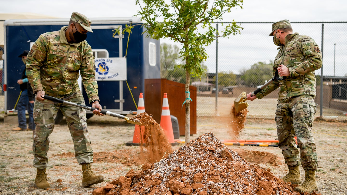 The 27th Special Operations Wing commander, Col. Robert A. Masaitis, signs into effect Arbor Day ceremony at Cannon Air Force Base, N.M., on April 26, 2021. The tree planting ceremony highlights the goal of building a sustainable future.