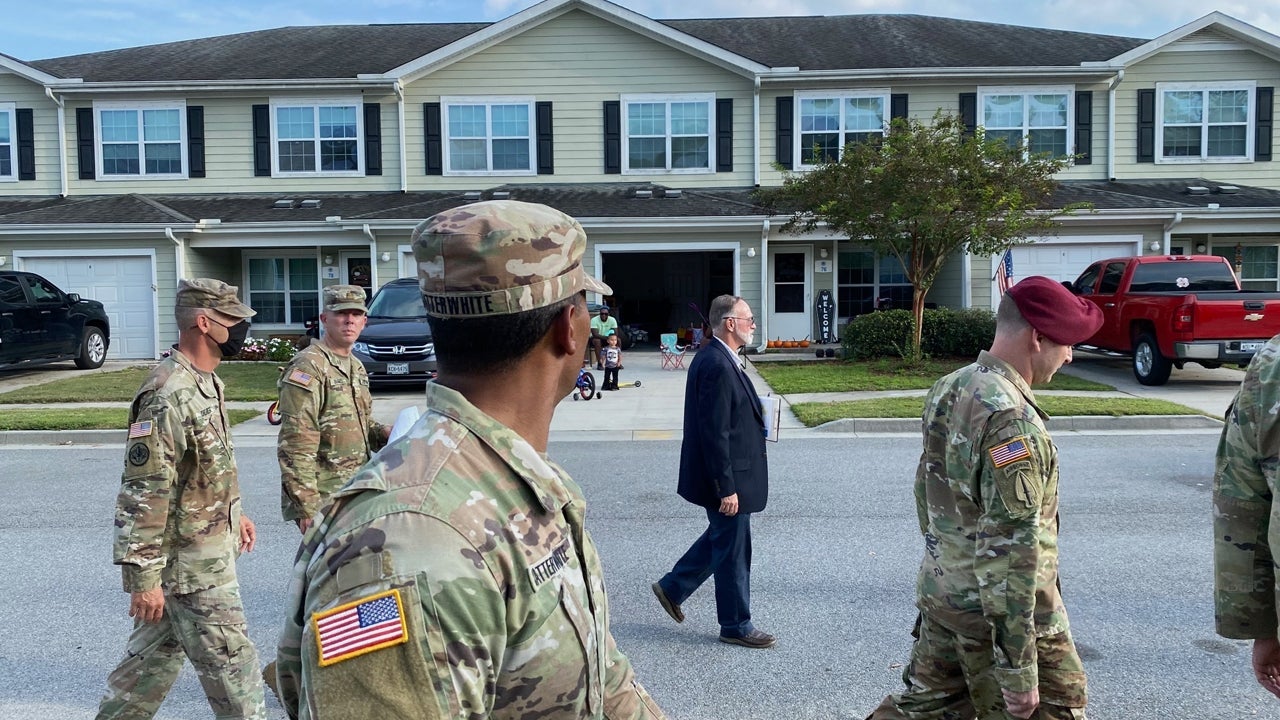 Doug Delzeith (center), Directorate of Public Works Housing Division, walks with Hunter Army Airfield leaders through Hunter Ridge housing area during town hall, Oct. 14. (Molly Cooke/U.S. Army)