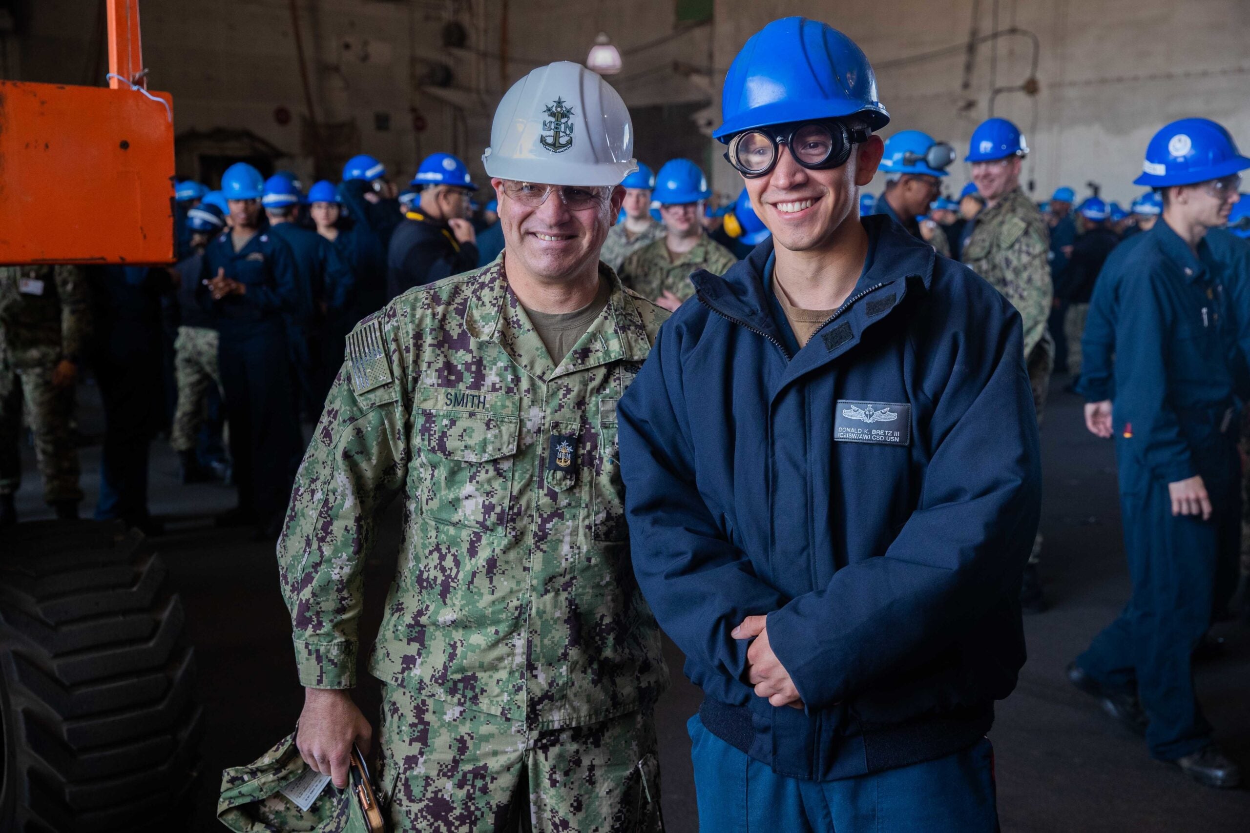 220422-N-CM740-1209

NEWPORT NEWS, Va. (April 22, 2022) – Master Chief Petty Officer of the Navy Russell L. Smith, left, poses for a photo with Interior Communication Electrician 2nd Class (SW/AW) Donald K. Bretz, assigned to combat systems department aboard the Nimitz-class aircraft carrier USS George Washington (CVN 73), after addressing the crew in an all-hands call in the ship’s hangar bay April 22. George Washington is currently conducting refueling Complex Overhaul (RCOH) at Newport News Shipyard. RCOH is a multi-year project performed only during a carrier’s 50-year service life that includes refueling the ship’s two nuclear reactors, as well as significant repairs, upgrades, and modernization. (U.S. Navy Photo by Mass Communication Specialist 2nd Class Robert J. Stamer)