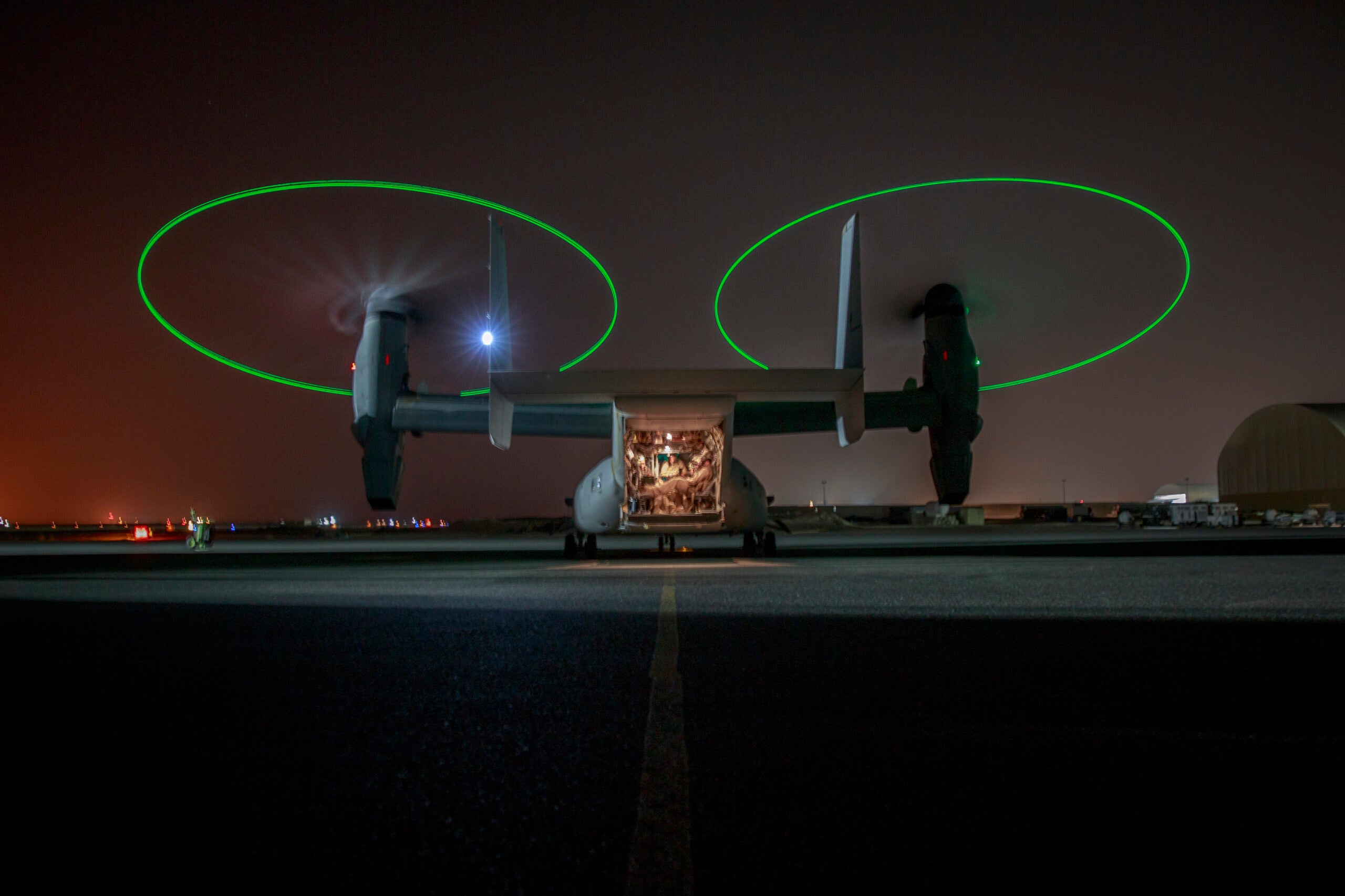 UNDISCLOSED LOCATION, MIDDLE EAST – An MV-22 Osprey with Marine Medium Tilt-rotor Squadron 164 loaded with Marines attached to 3rd Battalion 7th Marine Regiment prepare to execute a tactical recovery of aircraft and personnel (TRAP) exercise July 8, 2018. The exercise simulated the rescue of two downed pilots in a night time environment. (U.S. Marine Corps photo by Cpl. Gabino Perez)