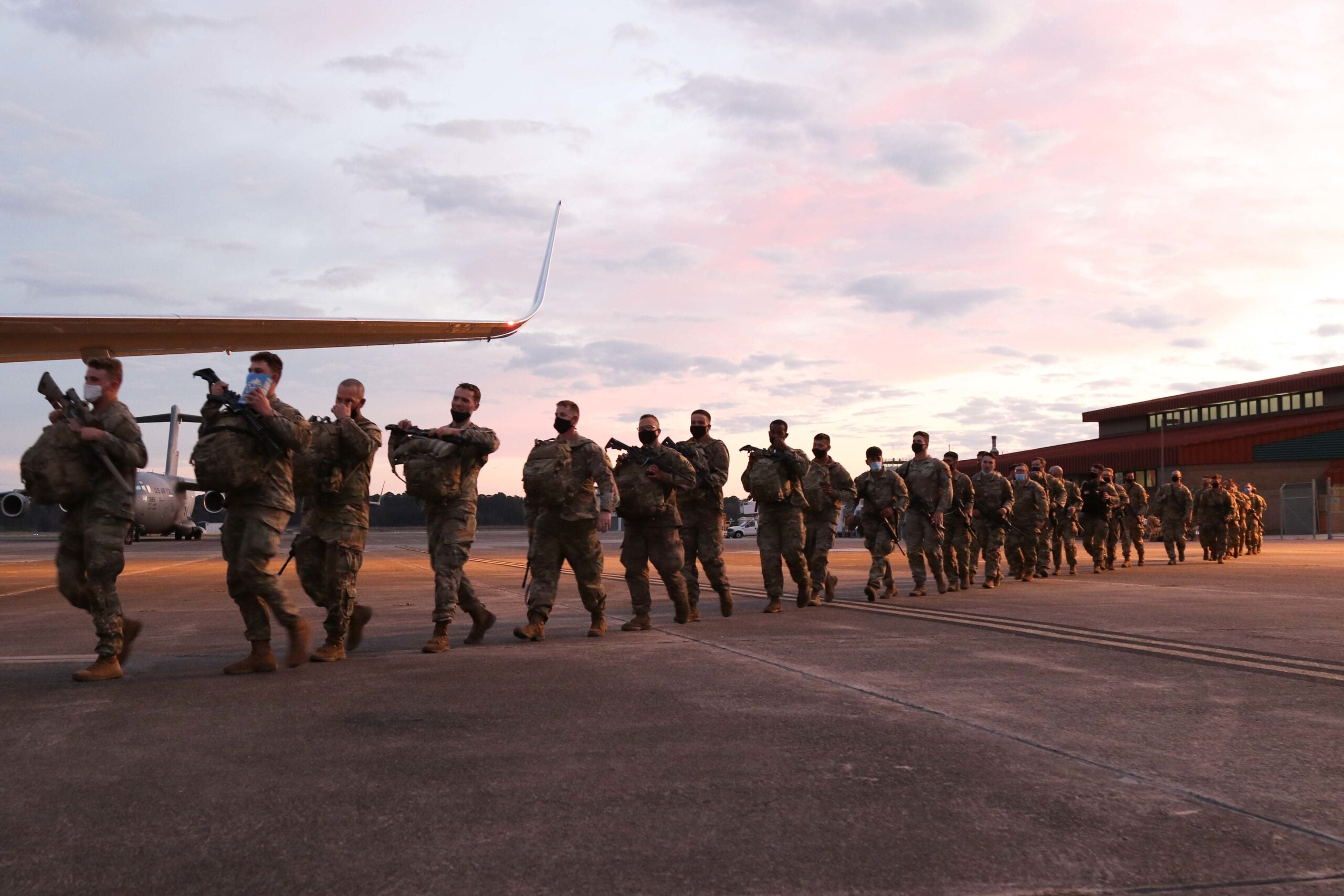 U.S. Army service members assigned to the 1st Armored Brigade Combat Team, 3rd Infantry Division, deploy to the U.S. Army Europe and Africa area of operations, from Hunter Army Airfield, Georgia, Feb. 28, 2022. The 1st ABCT, 3rd ID is the major unit of the 7,000 service members ordered to deploy by U.S. Secretary of Defense Lloyd J. Austin III to enhance deterrence of Russia. (U.S. Army photo by Sgt. 1st Class Jason Hull)