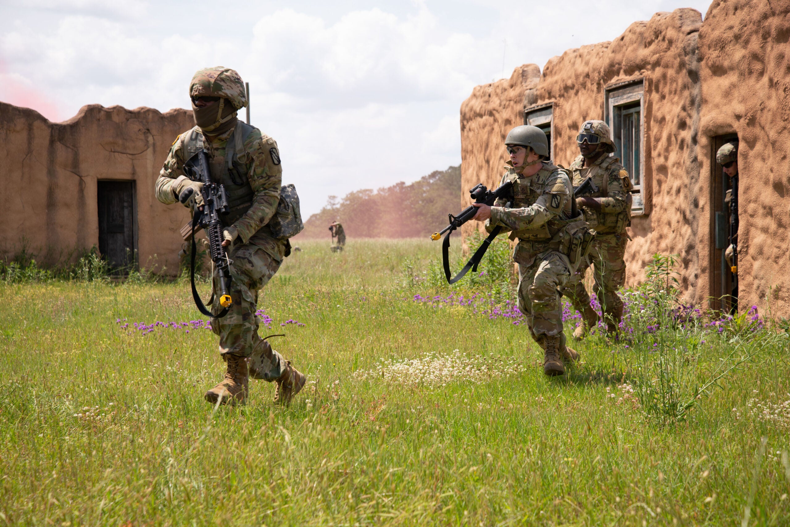 U.S. Army Soldiers with 1st Squadron, 98th Cavalry Regiment, 155th Armored Brigade Combat Team, Mississippi Army National Guard, conduct Military Operations in Urban Terrain (MOUT) training during a Proof of Concept exercise at Camp Shelby Joint Forces Training Center, Mississippi, April 29, 2022. The exercise was a part of Southern Strike 2022, a special operations-centric exercise that promotes interoperability between special forces, conventional ground forces, and air assets in order to ensure the U.S. military stays relevant and ready to respond to a peer-to-peer, large-scale combat operation. (U.S. Air National Guard photo by Tech. Sgt. Charles Wesley)