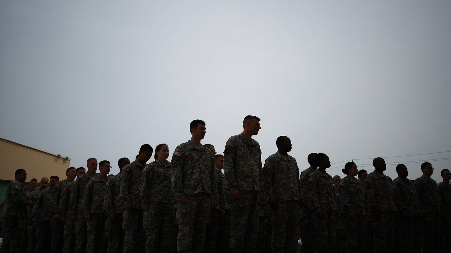 Soldiers from the U.S. Army's 101st Airborne Division stand in formation before marching into a homecoming ceremony at Campbell Army Airfield on March 21, 2015 in Fort Campbell, Kentucky. (Luke Sharrett/Getty Images)