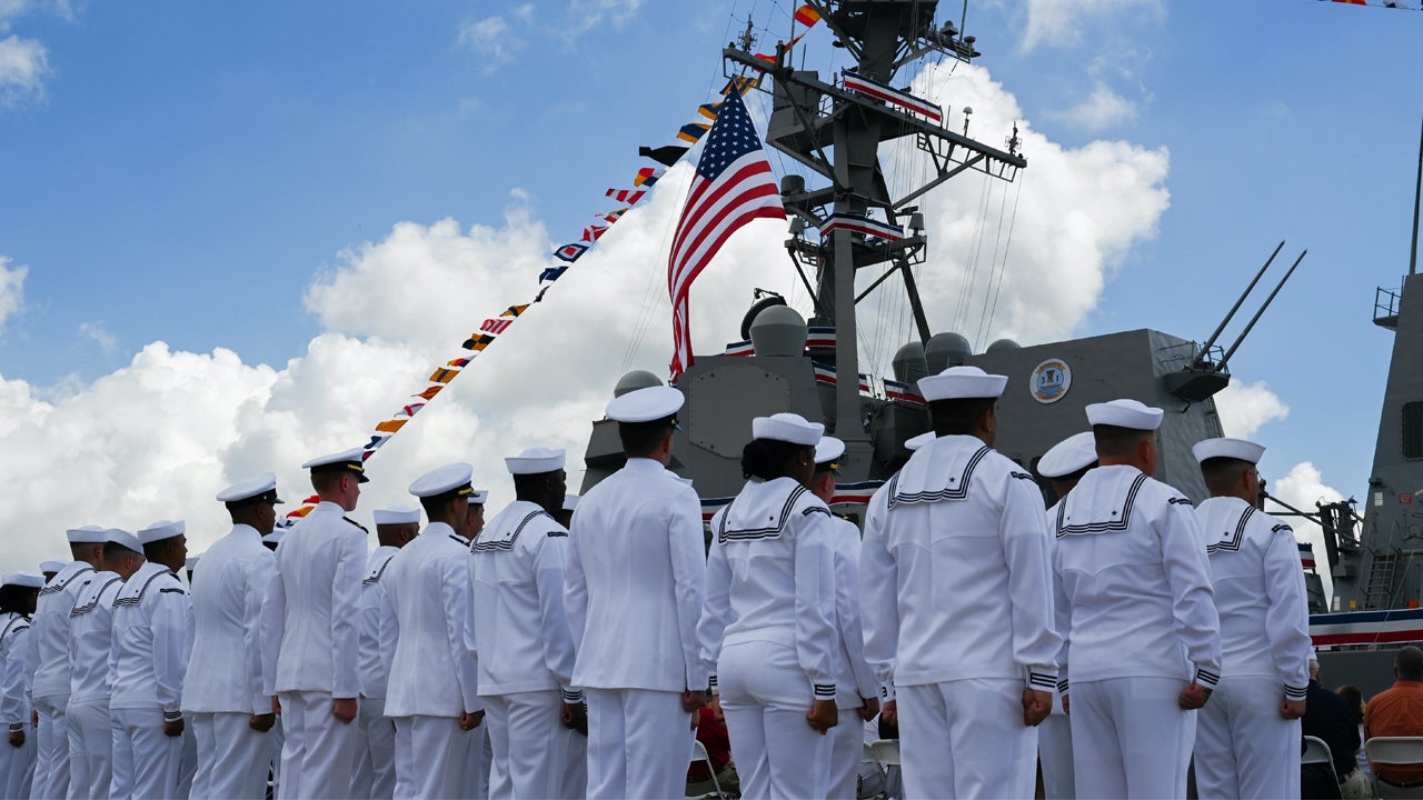U.S. Navy sailors stand at attention during the commissioning of the USS Frank E. Petersen Jr. in Charleston, S.C., May 14, 2022. 