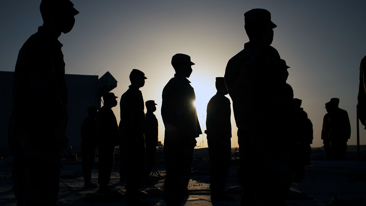 Iowa National Guard Soldiers of the Headquarters and Headquarters Company, 734th Regional Support Group, gather on a rooftop at Al Asad Air Base on the evening of March 5, 2021. (Chief Warrant Officer 3 Kelly Moeller/U.S. Army National Guard)