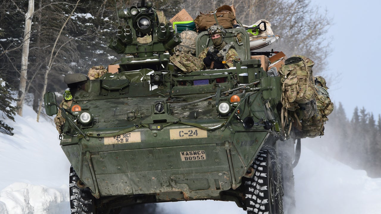 A Stryker vehicle from the 3rd Battalion, 21st Infantry Regiment moves down a snowy road in the Donnelly Training Area during Joint Pacific Multinational Readiness Center 22-02, March 22, 2022. (John Pennell/U.S. Army)