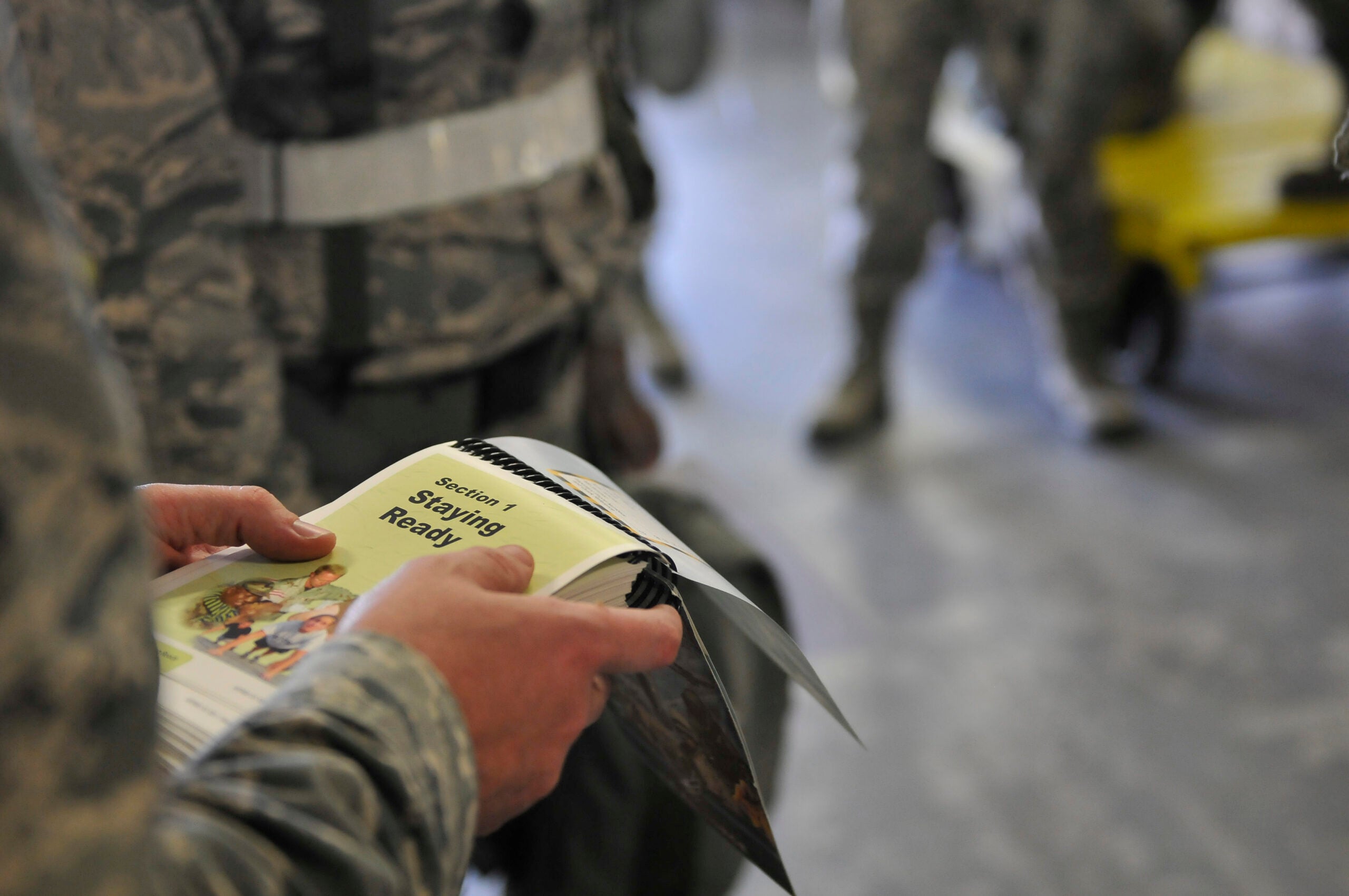 Airman reviews the Airman's Manual for Self Aid Buddy Care (SABC) during the Eagle Claw 2016 exercise at the 125th Fighter Wing in Jacksonville, Florida, March 7, 2016. The exercise tested the Airmen's ability to accomplish mission objectives through contested and degraded conditions.