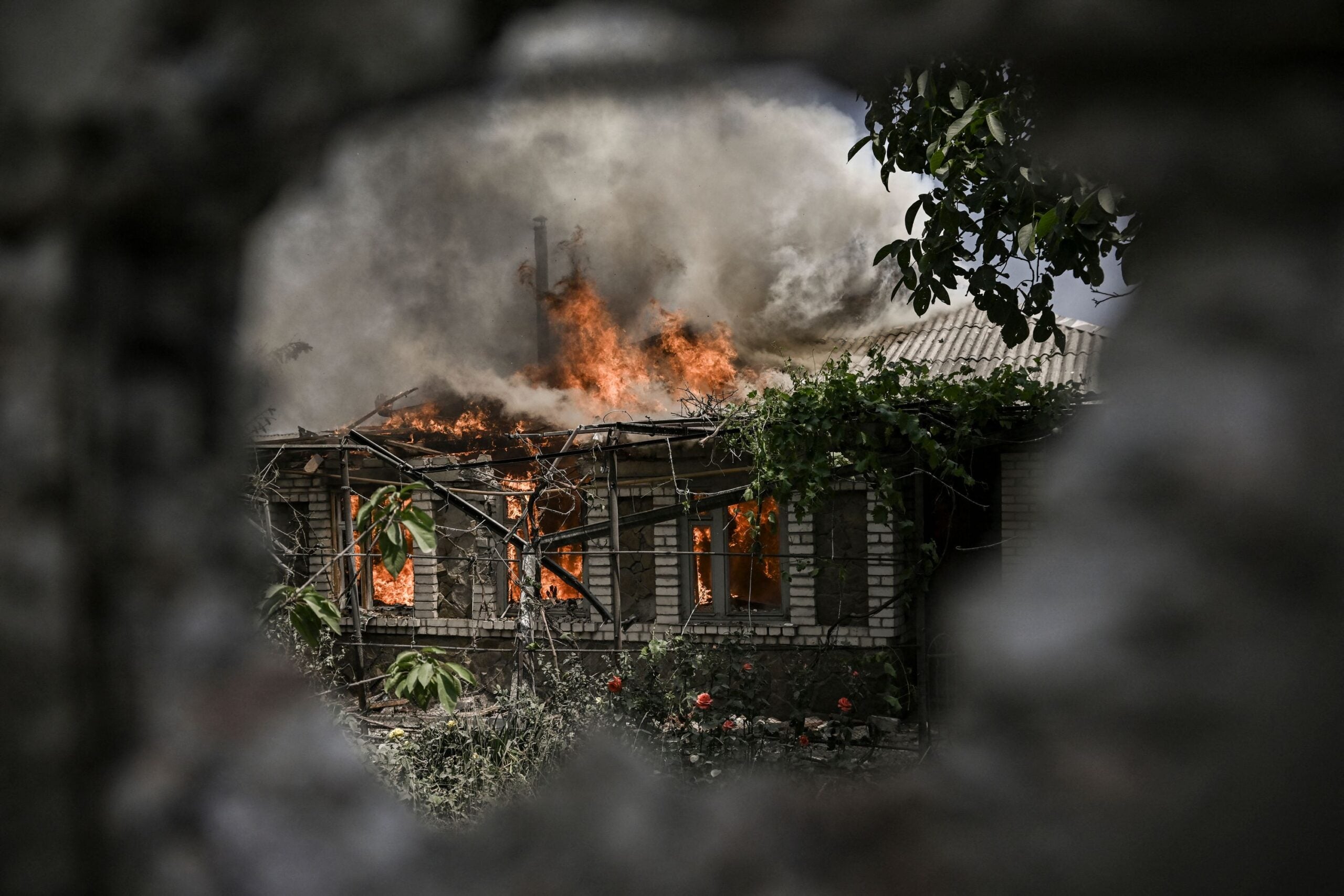 A house burns after being shelled during an artillery duel between Ukrainian and Russian troops in the city of Lysychansk, eastern Ukrainian region of Donbas, on June 11, 2022. (Photo by ARIS MESSINIS / AFP) (Photo by ARIS MESSINIS/AFP via Getty Images)