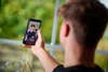 22 October 2020, Schleswig-Holstein, ---: Falco Punch, musician and star of the internet platform TikTok, is standing in the living room of his parents' house in a village in Schleswig-Holstein and is recording a video on his smartphone. The 24-year-old has more than nine million fans from all over the world. trademark of his videos: Fast, invisible cuts. A tennis ball or sneakers can play an important role. (to dpa "Invisible transitions - Falco Punch is a TikTok star") Photo: Gregor Fischer/dpa (Photo by Gregor Fischer/picture alliance via Getty Images)